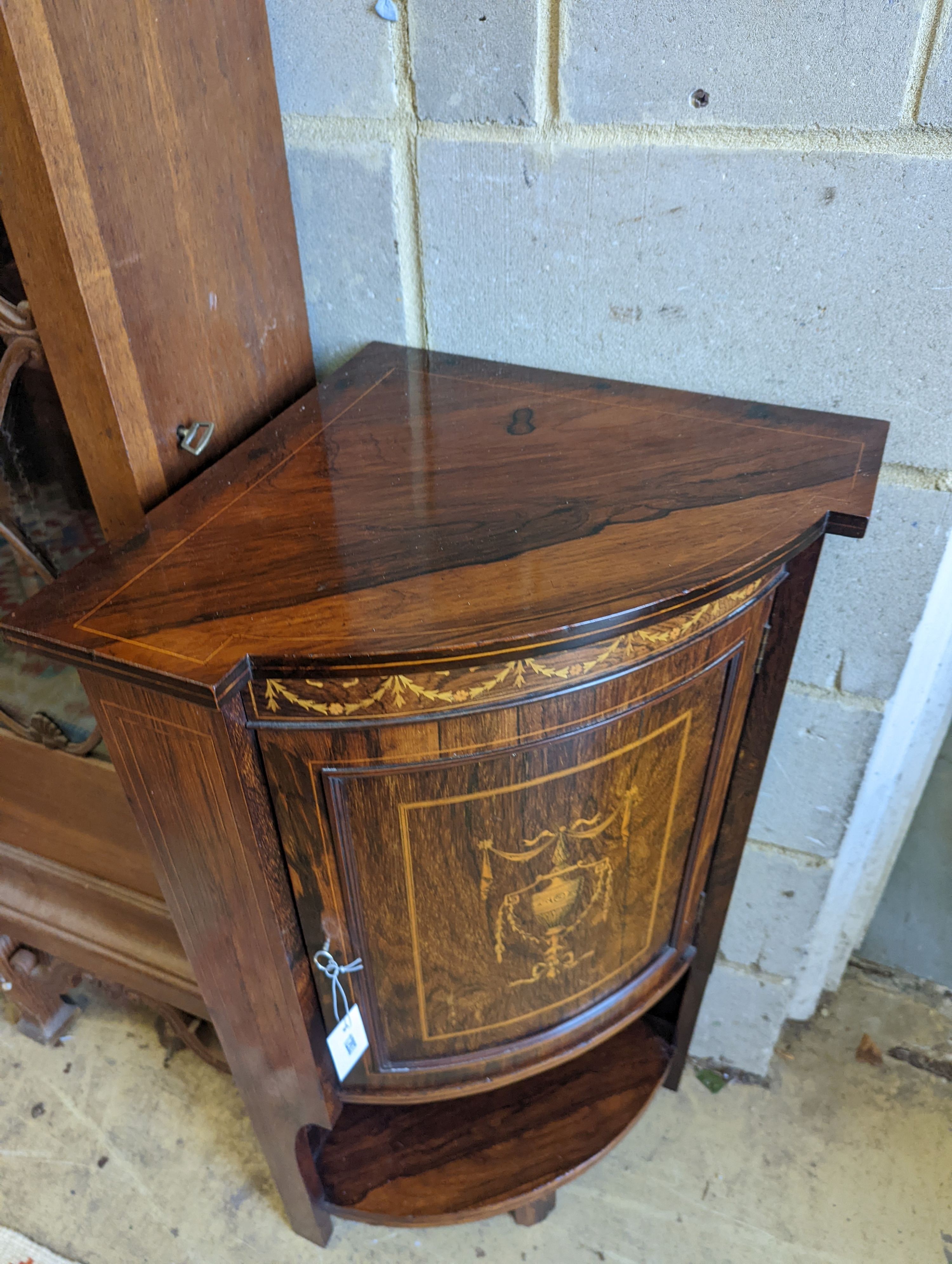 An Edwardian marquetry inlaid rosewood bowfront corner cupboard, width 61cm, depth 43cm, height 97cm
